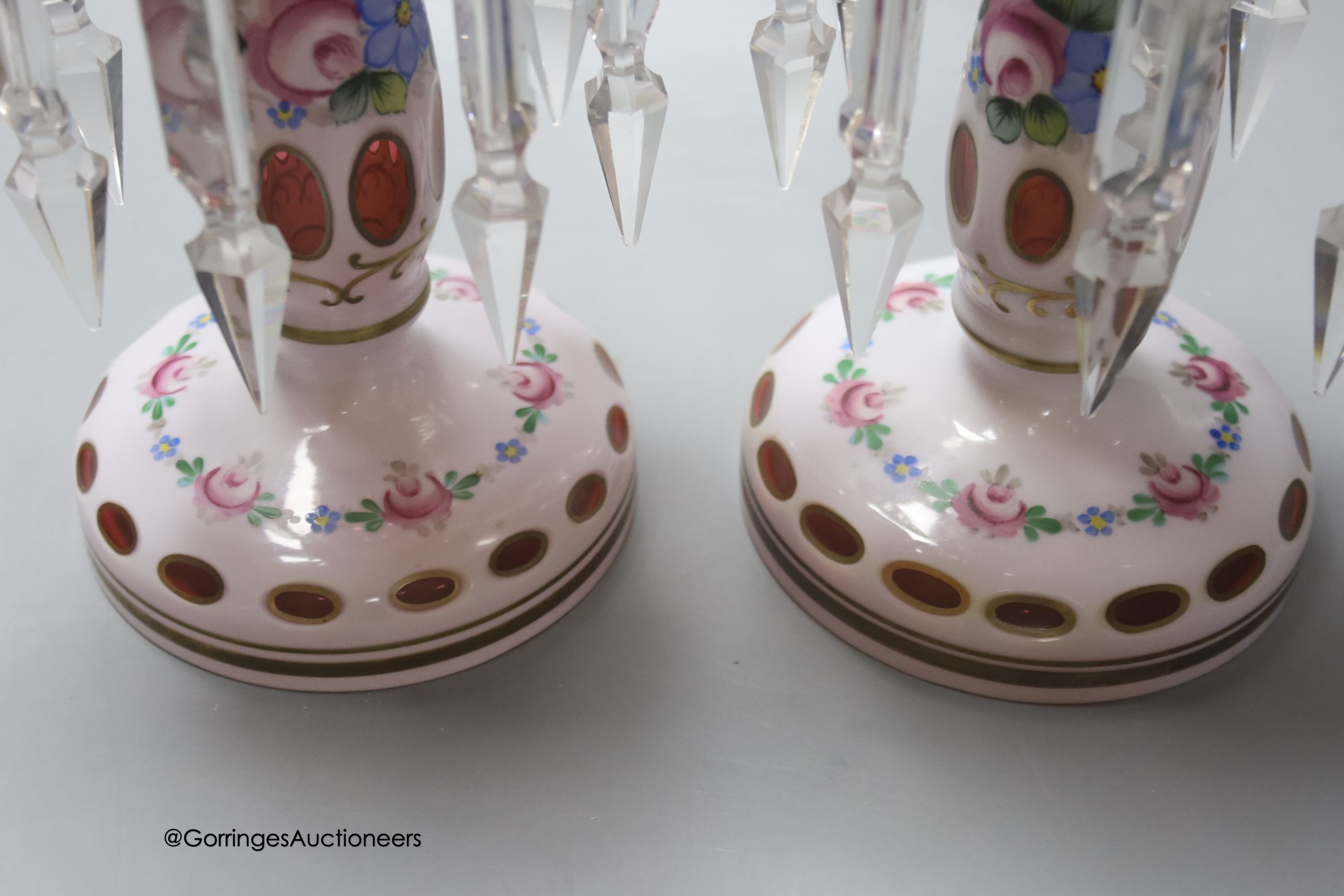 A pair of 19th century Bohemian overlay glass lustres decorated with flowers, height 25cm